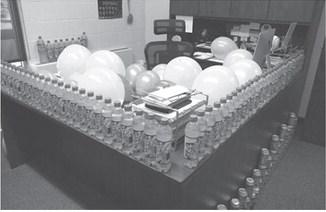 Some of the Mountain Dew decorating Mr. Babinski’s office on his 65th birthday Tuesday. Photo by Lyle Van Camp.