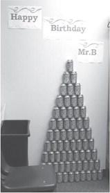 A pyramid of Mountain Dew cans and banner were part of the decorations for Mr. Babinski’s birthday. Photo by Lyle Van Camp.