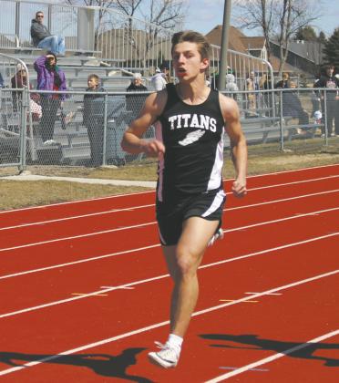 Carter Johnson eyes his competition over his shoulder while sprinting to the finish line during the 100 meter dash in the Grafton meet last week. Photo by Andrea Johnston