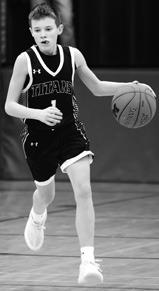 Drew Passa brings the ball up the court in action Monday evening at Minto. Photo by Lyle Van Camp.