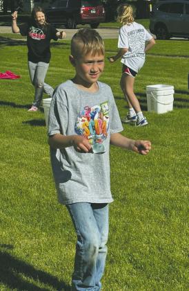 TK Callahan steadily balances a water balloon in a race. Submitted photo.
