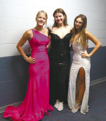 Juniors Alyssa Hoyles, Alyvia Quibell, and Taylor Hermanson looking fancy for Dress Your Best Day. Photo by Jamie Rarick