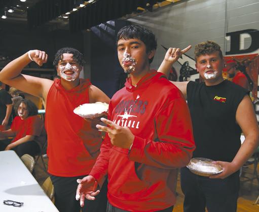 Jerimiah Johnson, Juan Navarro, and Ethan Lund following the pie eating competition. Photo by Jamie Rarick