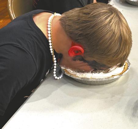Shawn Patterson puts his all into the pie eating contest during homecoming activities last Friday. Photo by Lyle Van Camp