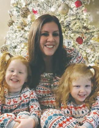 Megan with her two daughters in their matching Christmas pajamas. Photo compliments of Megan Kelka.