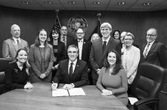 On March 24, Gov. Doug Burgum signed House Bill 1398, requiring K-12 public and non-public schools to provide instruction in computer science and cybersecurity. Kirsten Baesler, state superintendent of public instruction, is to Burgum’s right. Photo courtesy of the Governor’s Office.