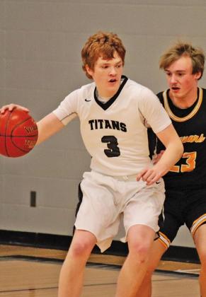 Brayden Johnson attempts to dribble around Jaguar Brock Carpenter last Tuesday night in the Drayton Gym. VNV photo by Lesa Van Camp
