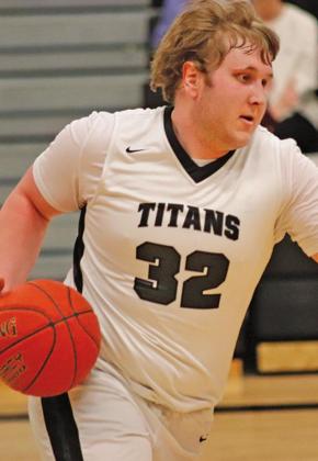 Lukas Pastorek dribbles the ball across the court last Thursday night in the Drayton gym against Cavalier. VNV Photo by Lesa Van Camp