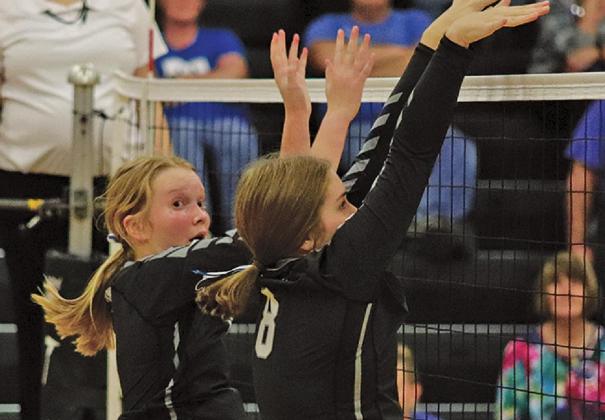 Easton Larson (l) and Kiara Aasand (r) go up for the block against the Hillsboro - Central Valley Burros last Thrusday night in the Drayton gym. VNV Photo by Lesa Van Camp