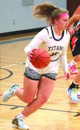 Aleah Pokrzywinski moves the ball up the court against Cavalier.