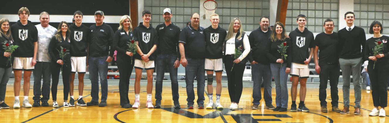 The Titans seniors stand with their parents on Senior Night, which was celebrated Feb. 13 at the game against Park River. Photo by Lyle Van Camp.