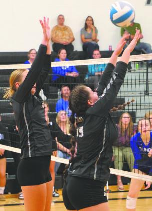 Easton Larson and Christine O’Toole go up for a block attempt in Drayton last week. Photo by Lyle Van Camp