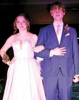 Kesli Staskivige and Ian Passa pause during the Grand March for the audieance to see them and to allow time for pictures. VNV Photo by Lesa Van Camp
