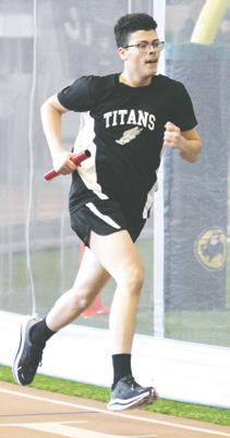 Daniel De Souza runs his leg of the boys’ 4 x 600 relay. Photo by Lyle Van Camp.