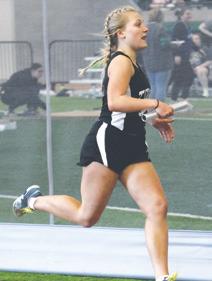 Reese Fering in the girls’ 4 x 300 relay. Photo by Lyle Van Camp.