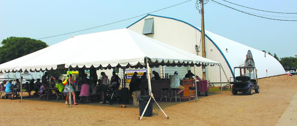 An outdoor bar and seating was set up in front of the Curling Club as the bonspiel and other events were going on inside. Photo by Andrea Johnston