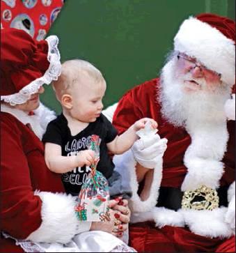 Santa and Mrs. Claus were a hit with the little ones when they arrived in Drayton for Old Fashioned Christmas on Saturday. VNV Photo by Lesa Van Camp