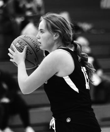 Aleah Pokrzywinski looks for an open Titan in action at Grafton. Photo by Lyle Van Camp.