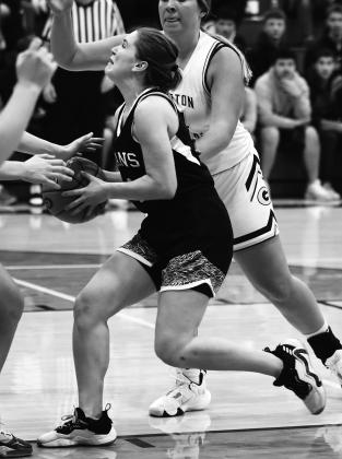 Greta Burrell is tied up by Grafton's stingy defense. Photo by Lyle Van Camp.