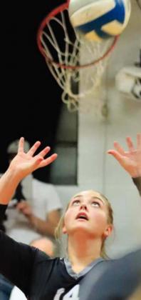 Aliyah Bartels sets the ball in action against the Mustangs Monday evening. VNV Photo by Lyle Van Camp