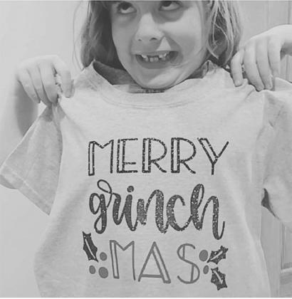 My kiddo acting silly displaying a t-shirt she helped me make three years ago.