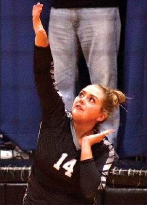Aliyah Bartles serves against the Spoilers in the Crystal gym last week. VNV Photo by Lesa Van Camp