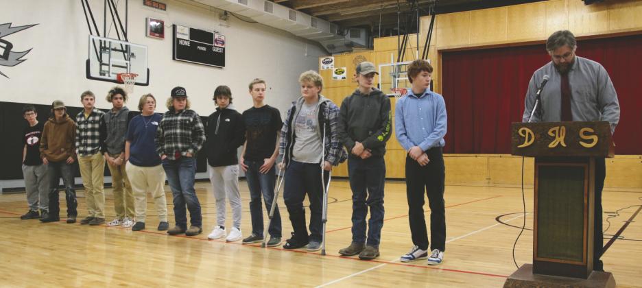 Football, from left to right: Jonah Rarick, Hunter Sherrill, Cayden Quibble, Mason Pollestad, Kyler Lizakowski, Lincoln Aasand, Trenten Bronson-Keena, Gavin Ryan, Bryce Wimpfheimer, Grant Vold, James Larocque, Coach Foster. Photo by Lyle Van Camp.