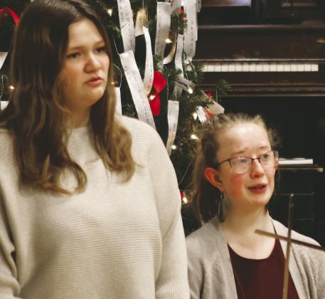 Alyson VanCamp and Siobhan Kissee played a flute duet and led a sing along Thursday evening. Photo by Lyle Van Camp.