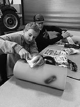Youth at an NDSU Extension tractor safety camp practice Stop the Bleed techniques. (NDSU photo).