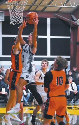 Player of the game, Trenton Keena, in the Titans’ win over Cavalier. Keena finished the game with 20 points and made 8 of 11 free throws. Photo by Larry Stokke