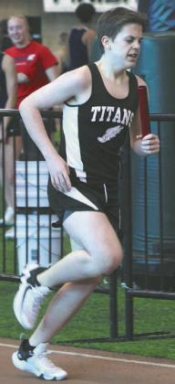 Gavin Cole running a leg in the boys 4 X 300 relay. Photo by Lyle Van Camp.