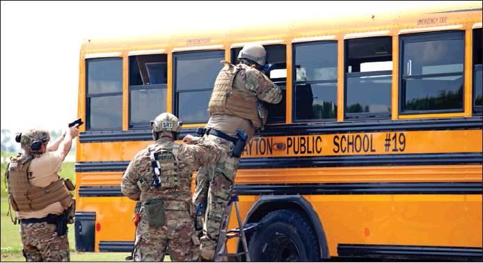 Shortly before the start of the school year the Northeastern Special Response Team held a special tactical training in Drayton using a Drayton Public School bus for one portion of their hostage training. VNV Photo by Lesa Van Camp