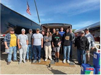 The FFA group poses together at Big Iron, the largest farm machinery show in the midwest. Adam R, Hunter J , Grant V, Bryce W, Stephanie K, Abby C, Jeremiah J, Alyvia Q, Hailey B, Grant U, Jaxon W, James L.