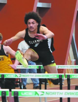 DVE junior Mason Pollestad gets an early lead over competitors in the Men's 60M Hurdles, winning the event with a personal best of 8.60. Photo by Jamie Rarick