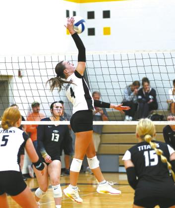 Jocelyn Vold gets above the net to send the ball over during tournament play. Photo by Larry Stokke