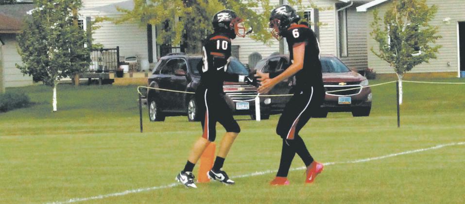 Teammates Shawn Patterson and Jonah Rarick celebrate in the endzone following a Bomber touchdown. Photo by Jamie Rarick
