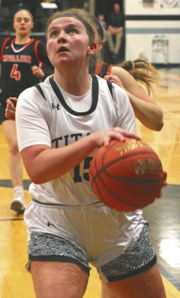 Aleah Pokrzywinski drives the lane against the Tornadoes. Photo by Lyle Van Camp.
