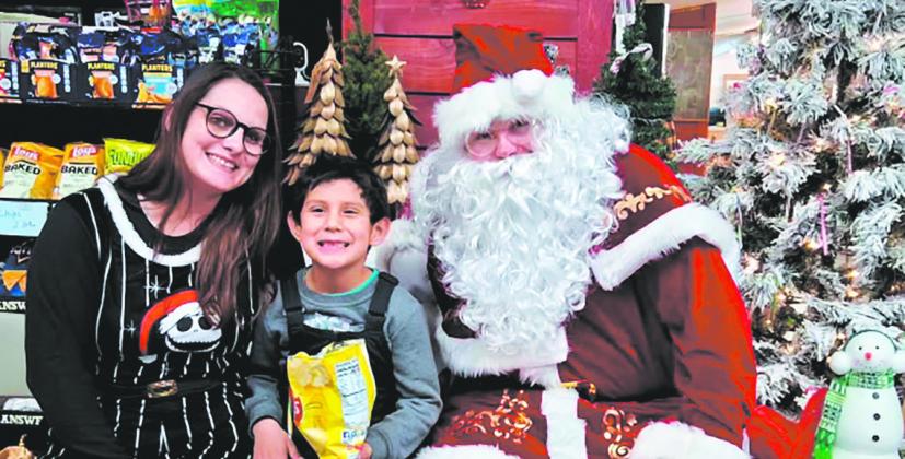 Santa visited with shoppers at Halcrow's during Drayton's Old Fashioned Christmas. Photo by Christine Jensen