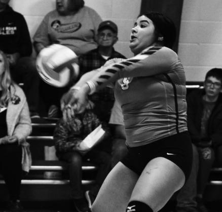 Senior Emily Gonzalez gets one of her team leading nine digs in Friday's game at Pembina. Photo by Mike Alan Steinfeldt.