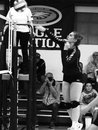 Senior Kiara Aasand records one of her two kills vs. North Border (3 and 10) Photo by Mike Alan Steinfeldt.