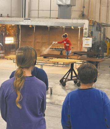 Employees show local students the process of building, priming, and painting windows during a tour of the Marvin plant in Grafton as part of the Pembina-Walsh MFG Day event. Submitted photo