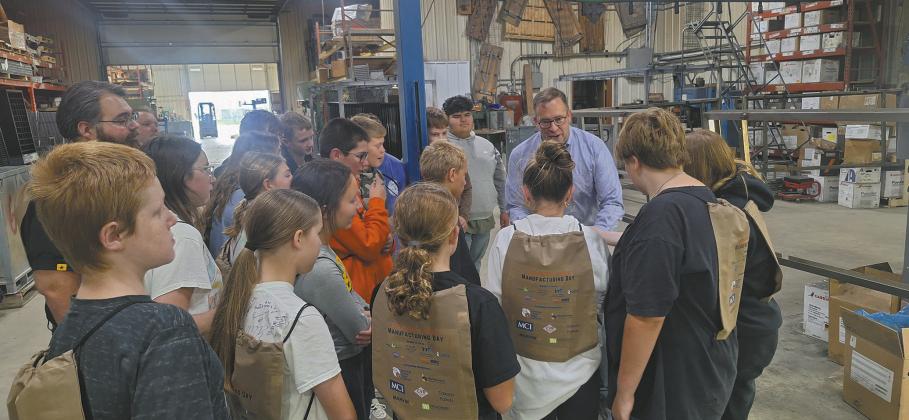 Seventh graders are shown how Bordertown Retail Systems produces custom racks for retailers at the Pembina-Walsh Manufacturing Day event. Submitted photo.