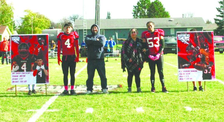 Bomber football seniors and their parents were recognized prior to Saturday's game. Pictured are seniors Trypp Castillo and Jerimiah Johnson with their parents. Photo by Jamie Rarick.