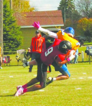 Mason Pollestad takes down the quarterback for a sack at Saturday's game. Photo by Jamie Rarick.