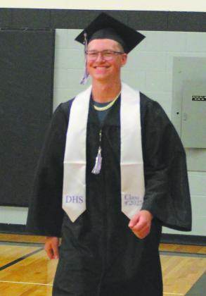 As he enters the ceremony, JJ Knudson was all smiles. Photo by Andrea johnston