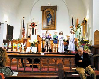 The youth at Drayton United Methodist Church sang unto the Lord continuing the celebration of Easter and the resurrection of Jesus Christ this past Sunday. Pastor Gary H. Johnson listened intently with a smile. A celebration meal was served after the service. Photo by Duane H.H. Lyon.