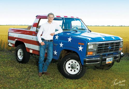 Rural Drayton teen Cody Narloch, who is a senior at Grafton High School, stands with 'Patriot' a 1984 Ford Bronco he restored with the help of family and friends. Photo Courtesy of Rock Tweten, Tweten's Photography, Grafton.