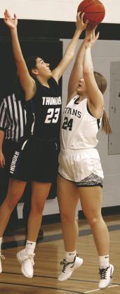 Kiara Assand attempts to shoot over Hatton-Northwood's Stella Serht. Photo by Lyle Van Camp.