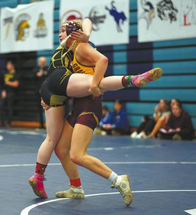 Alyssa Hoyles secures control during the regional tournament, where she claimed first place and a state berth. Photo by Larry Stokke