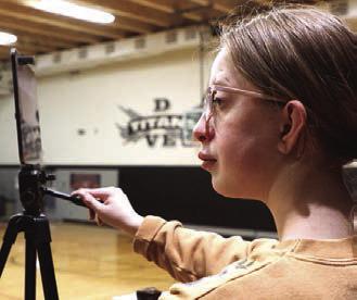 Siobhan Kissee keeps busy recording the games for the Titans.